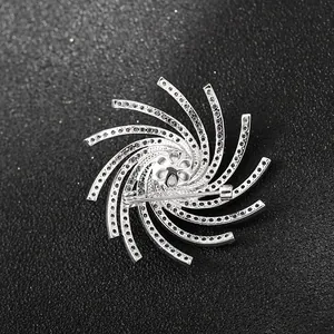 Macro view of silver rhinestone brooch back showing safety pin clasp and craftsmanship