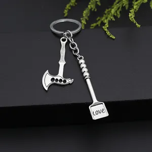Creative metal keychain set featuring a vintage axe and a shovel pendant with love engraving