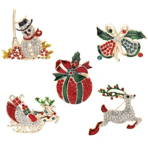 Christmas rhinestone brooch set featuring snowman, bell, and reindeer in vibrant festive colors