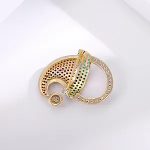 Macro shot of gold-plated Christmas brooch back showing hollowed craftsmanship and pin clasp