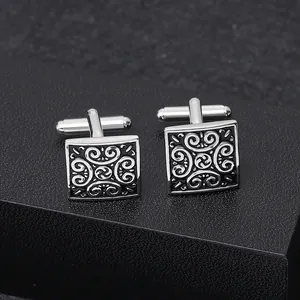 Square silver cufflinks with vintage scroll patterns and polished mirror finish for men