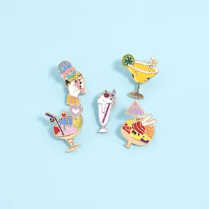 Macro detail of 5-piece summer enamel pins featuring ice cream and beach drinks