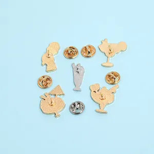 Detail view of colorful enamel brooch set backings with secure butterfly clutch fasteners