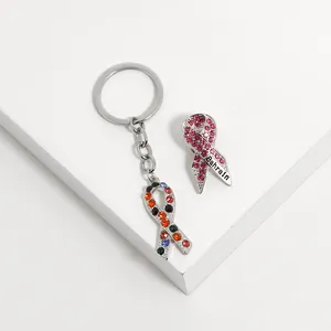 Pink ribbon brooch and colorful gemstone keychain set in silver alloy with Bahrain text