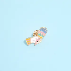 Detailed view of hand-held triple scoop ice cream enamel pin with golden metal edges