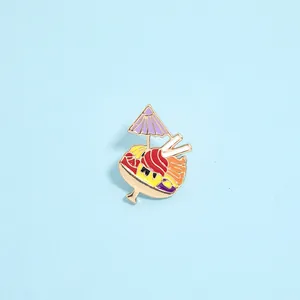 Detailed macro view of an enamel dessert pin with purple sunshade and golden metal edges