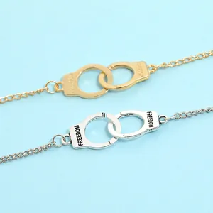 Minimalist handcuffs link bracelet in gold and silver finish with Freedom engraving