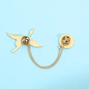 Detail of golden crane brooch with connecting chains and secure butterfly clasp back
