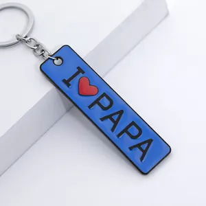 Detailed view of blue enamel rectangular keychain featuring black I ❤️ PAPA lettering