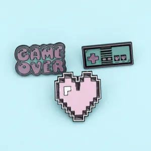 Three-piece set of retro pixel game enamel pins including game controller and heart badge