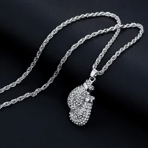 Macro shot of hip hop boxing glove pendant with sparkling cubic zirconia on black leather