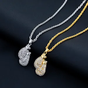 Macro shot of hip hop boxing glove pendant with white zircons on rope chain