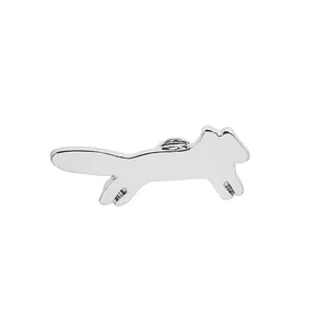 Detailed close-up of a fox-shaped silver metal brooch with a butterfly clutch back