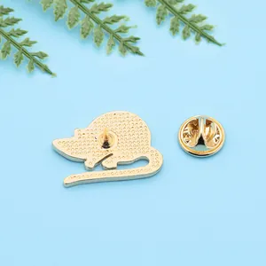 Back view of cute mouse enamel badge with golden pin and secure butterfly clutch fastener