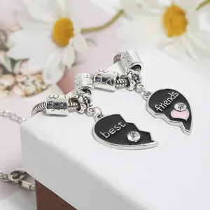 Detail of Best Friends heart puzzle bracelets with black enamel and crystal accents