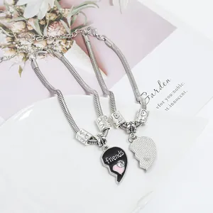 Detail of silver heart puzzle friendship bracelet with crystals and adjustable chain