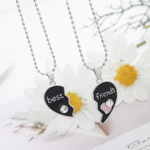 Silver best friends puzzle heart necklaces with black enamel and sparkling crystals