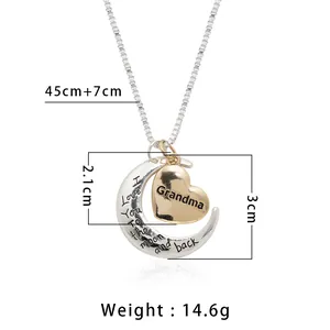 Zilveren halve maan en gouden hart ketting met I love you to the moon gravure