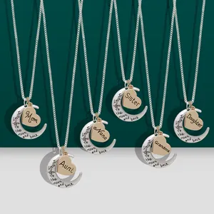 Detail of multi-style heart and moon necklaces with I love you to the moon and back text