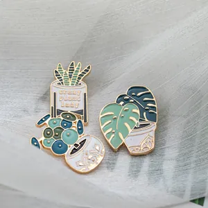 Cute enamel pins featuring monstera and cactus plants with 'Crazy Plant Lady' slogan