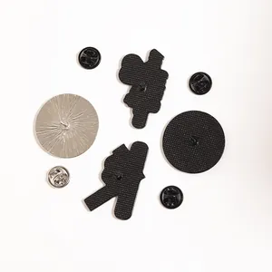Detailed view of alloy brooch backs with assorted black rubber and metal butterfly clutches