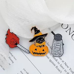 Halloween enamel pin set featuring a ghost match, pumpkin cat, and salty shaker charms