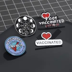 Detailed set of four enamel vaccine awareness and moon phase badges in zinc alloy
