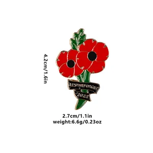 Detailed view of red poppy brooch with Lest We Forget ribbon and 2023 engraving