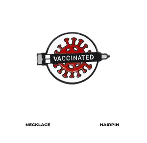 Macro shot of circular enamel lapel pin with VACCINATED syringe design for clothing