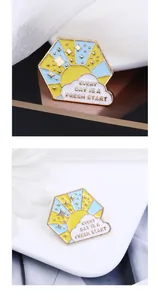 Detail of enamel pin with sun and stars featuring Every Day Is A Fresh Start quote