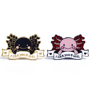 Cute axolotl enamel pins in pink and black with 'I like you a lotl' slogan on white background