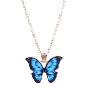 Fashionable gold chain necklace featuring a gradient blue butterfly pendant in boho style