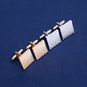 Men's square cufflinks in gold and silver with elegant woven texture on blue background