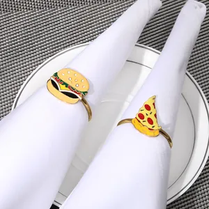 Detail of hamburger and pizza napkin rings with gold alloy and colorful enamel finish