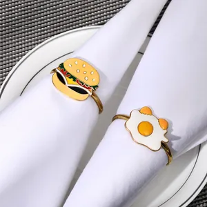 Cartoon burger and fried egg napkin rings set with golden metal ring and enamel finish