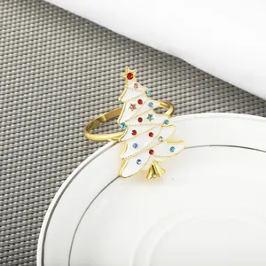 Golden Christmas tree napkin ring with white enamel and colorful rhinestones decor