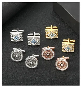 Detailed shot of assorted round and square cufflinks with zircon inlay in various metal finishes