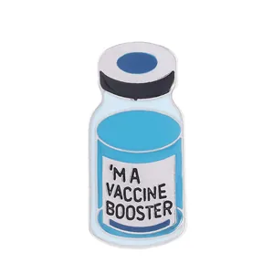 Creative enamel pin featuring a vaccine booster bottle design with blue liquid and black cap