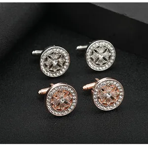Macro shot of silver and rose gold round cufflinks with zircon pavé and cross detail