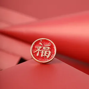 Festive Chinese New Year brooch with red gold Fu character design for luck and prosperity