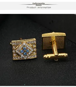 Macro view of gold rectangular cufflinks with zircon inlay and blue gemstones detail