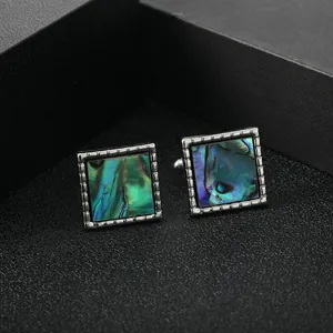 Luxury square cufflinks with iridescent abalone shell inlay and silver textured edges