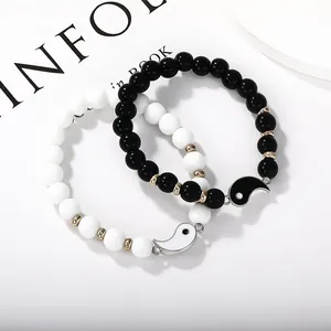 Yin Yang beaded bracelet set with black and white natural stones and gold metal spacers