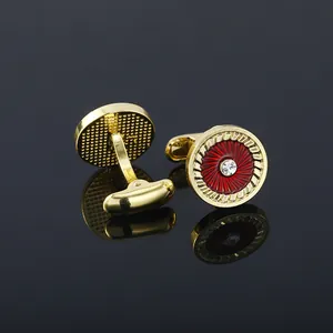 Elegant gold-tone round cufflinks with red enamel pattern and central crystal stone for men