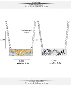 Detailed view of sun and mountain engraved pendants with rhinestone inlay for best friends