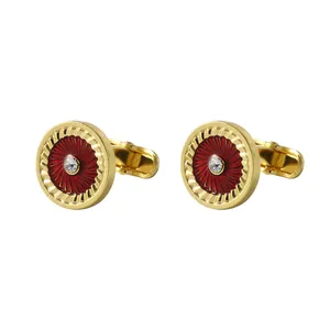 Elegant gold-tone cufflinks with deep red sunburst pattern and center-set zircon crystal