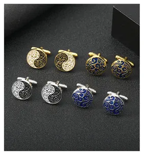 Detailed close-up of premium enamel cufflinks with Yin Yang and cloud motifs in gold and silver