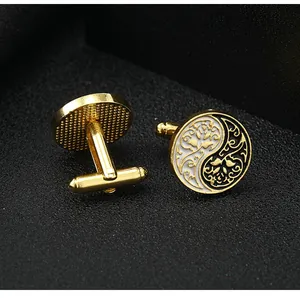Macro view of gold-plated Tai Chi cufflinks with enamel inlay and engraved details