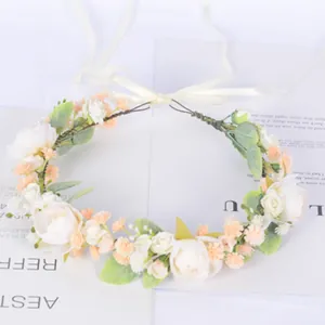 Bohemian floral crown with roses, white pearls, and silk ribbons for bridal headwear