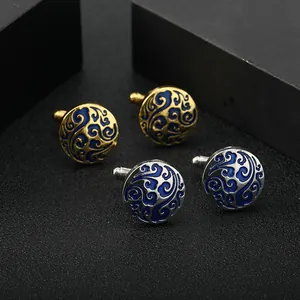 Men's cufflinks set in gold and silver with blue enamel waves on dark luxury gift box